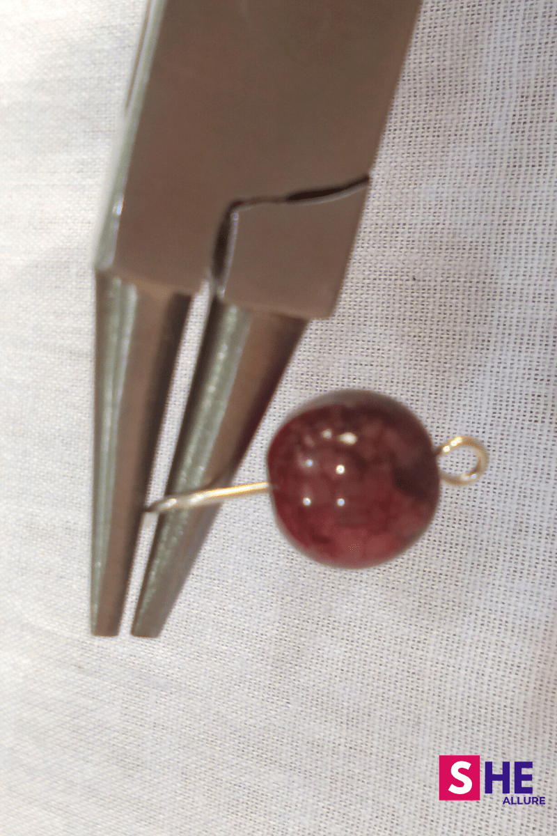 Make loop to make button earrings